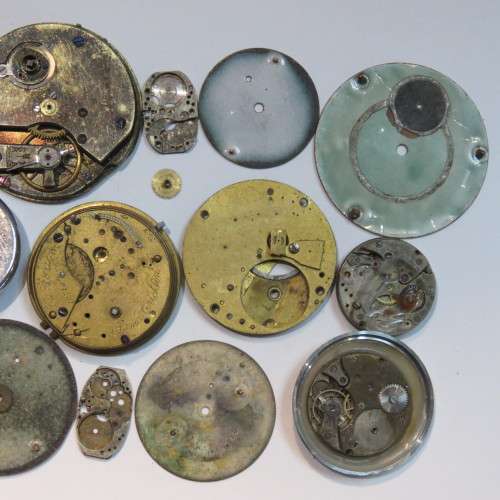 Lot of watch faces and broken movements