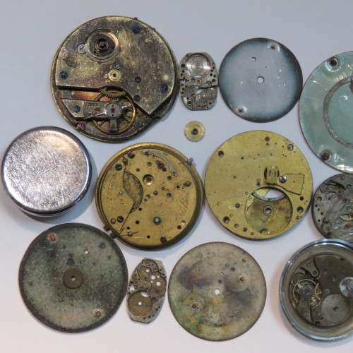Lot of watch faces and broken movements