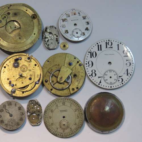 Lot of watch faces and broken movements
