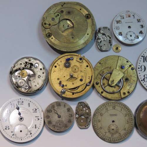 Lot of watch faces and broken movements