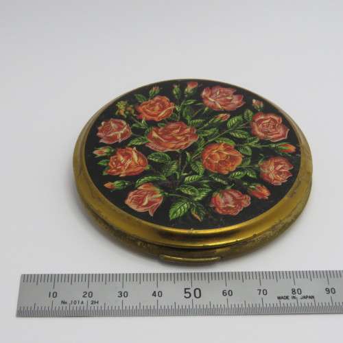 Vintage powder compact with roses design and leather pouch