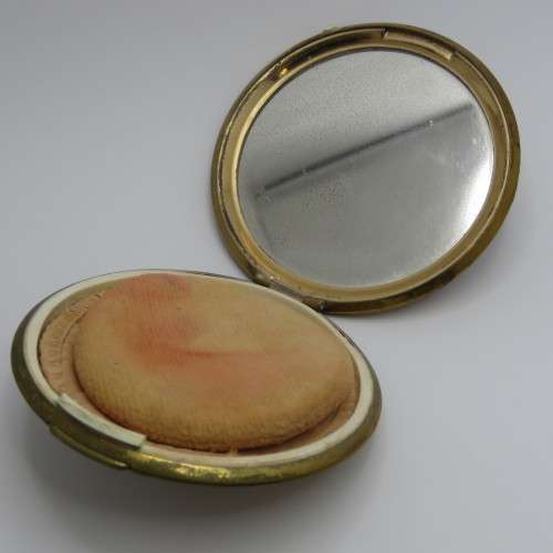 Vintage powder compact with roses design and leather pouch