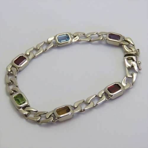 Costume unused silver look-alike bracelet with colored stones