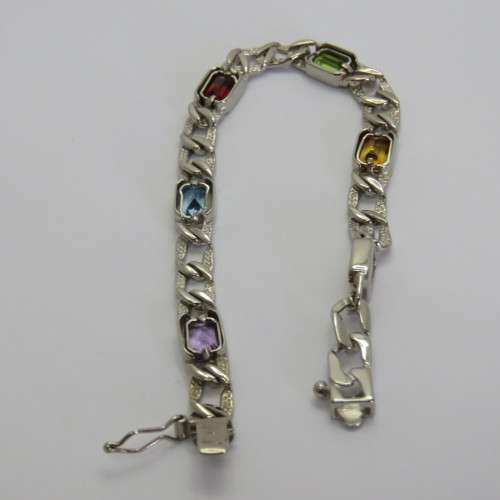 Costume unused silver look-alike bracelet with colored stones