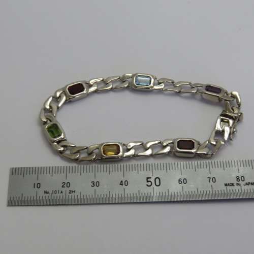 Costume unused silver look-alike bracelet with colored stones