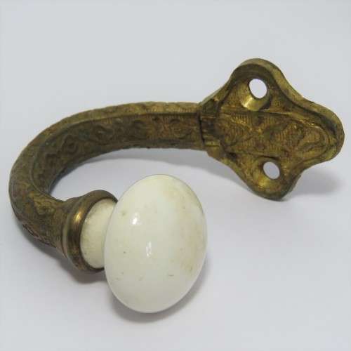 Vintage brass hook with porcelain knob