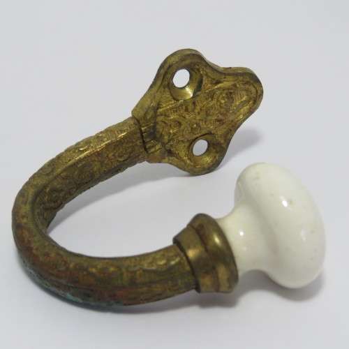 Vintage brass hook with porcelain knob