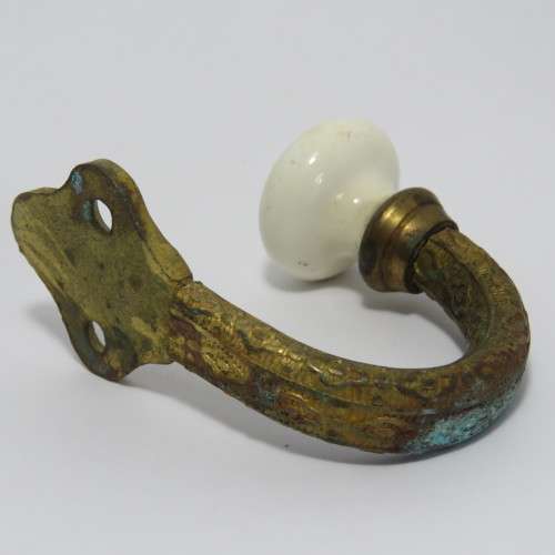 Vintage brass hook with porcelain knob