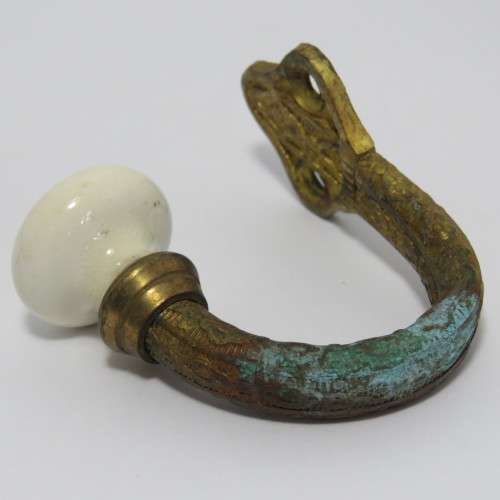 Vintage brass hook with porcelain knob