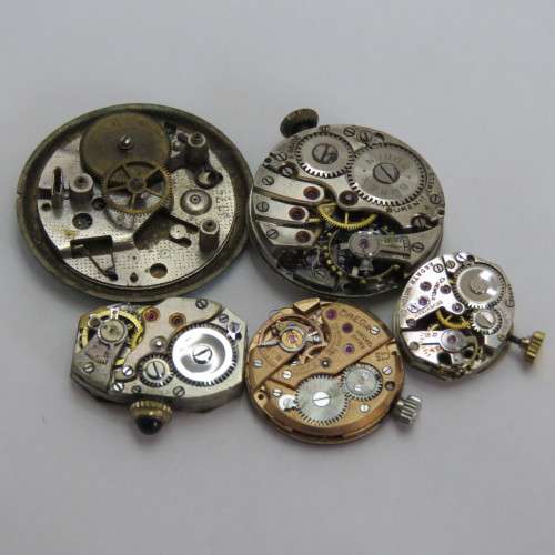 Lot of 5 mechanical watch movements for spares including Omega DeVille Caliber 620 - Not working