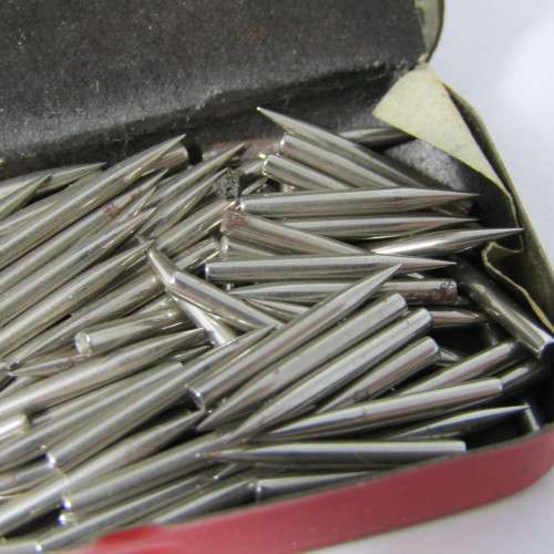 Almost full tin of gramophone needles in Trek tin