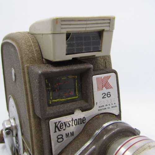 Vintage Keystone 8mm movie camera in damaged pouch - working