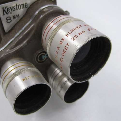 Vintage Keystone 8mm movie camera in damaged pouch - working