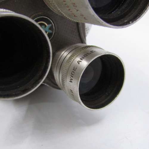 Vintage Keystone 8mm movie camera in damaged pouch - working