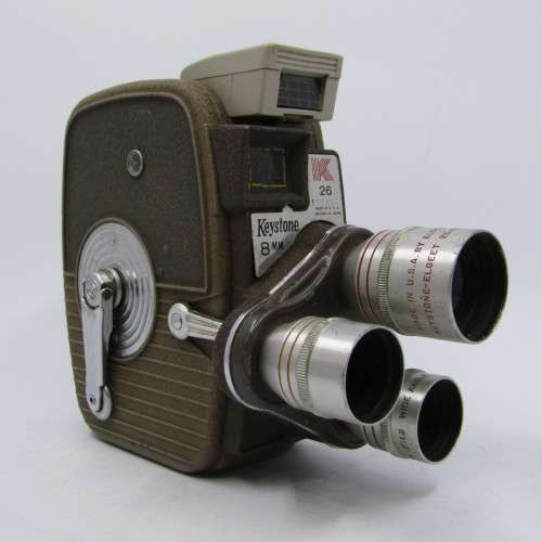 Vintage Keystone 8mm movie camera in damaged pouch - working