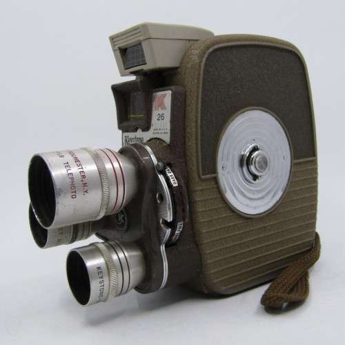 Vintage Keystone 8mm movie camera in damaged pouch - working