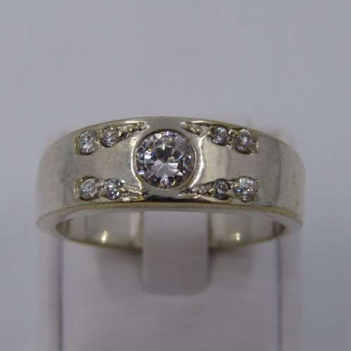 Sterling Silver ring with clear stones - weighs 8.8 grams - size Z/13