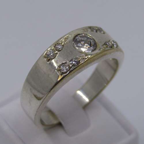 Sterling Silver ring with clear stones - weighs 8.8 grams - size Z/13