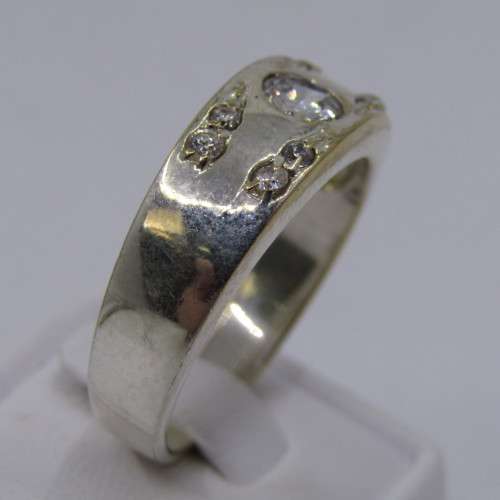 Sterling Silver ring with clear stones - weighs 8.8 grams - size Z/13