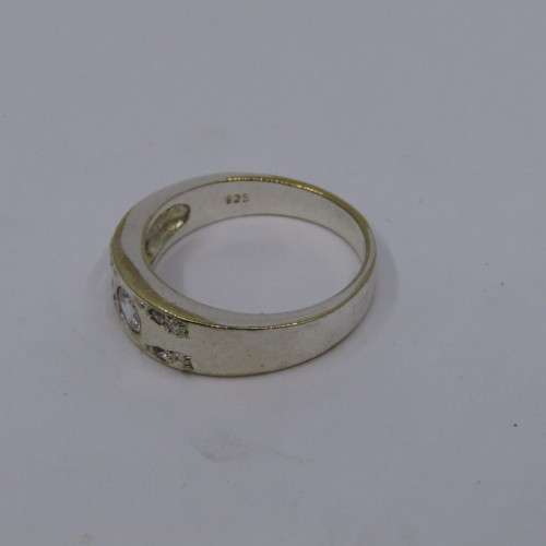 Sterling Silver ring with clear stones - weighs 8.8 grams - size Z/13