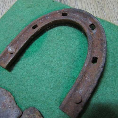 Board with antique horseshoes, some for oxen and ponies originating from South West Africa