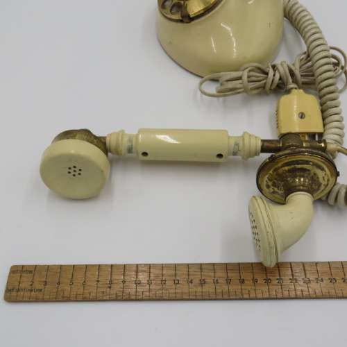 Vintage brass and plastic rotary dial telephone