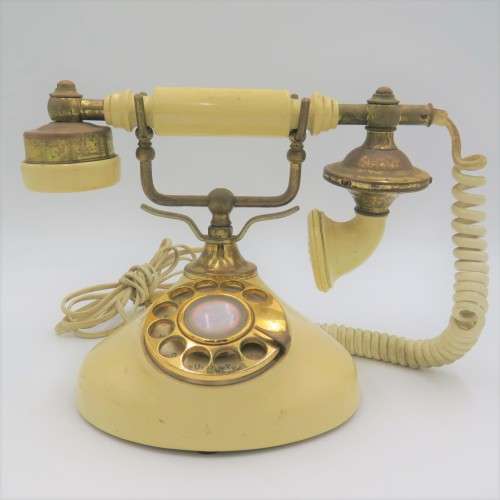 Vintage brass and plastic rotary dial telephone