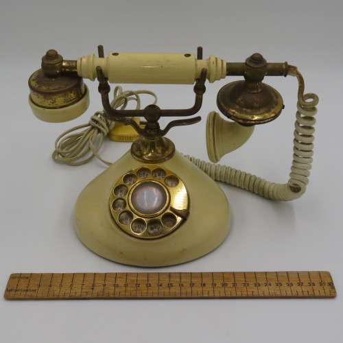 Vintage brass and plastic rotary dial telephone