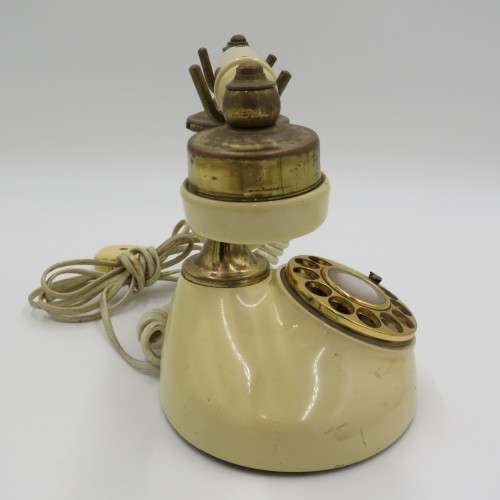 Vintage brass and plastic rotary dial telephone