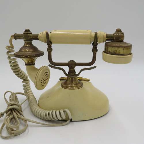Vintage brass and plastic rotary dial telephone
