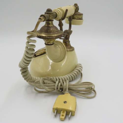 Vintage brass and plastic rotary dial telephone