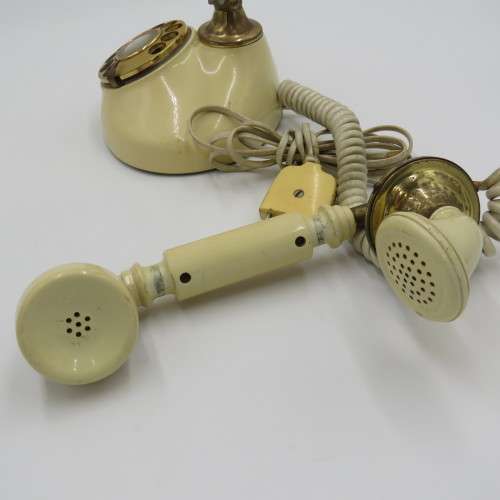 Vintage brass and plastic rotary dial telephone