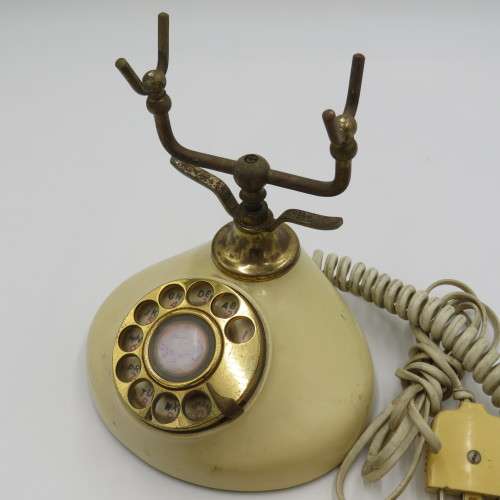 Vintage brass and plastic rotary dial telephone