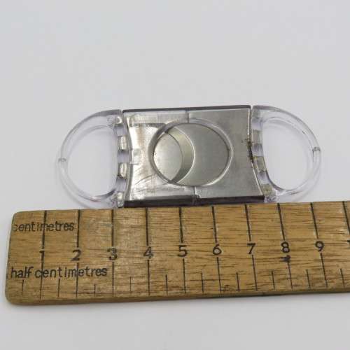 Plastic and metal cigar cutter