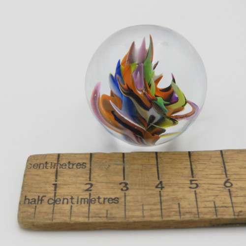 Vintage small handmade glass paperweight with multi-color swirls