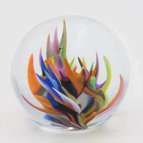 Vintage small handmade glass paperweight with multi-color swirls