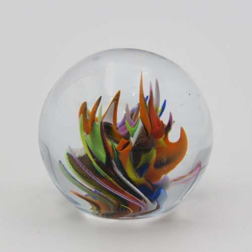 Vintage small handmade glass paperweight with multi-color swirls