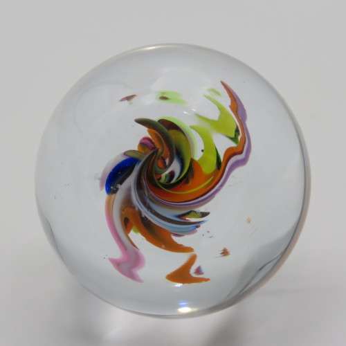 Vintage small handmade glass paperweight with multi-color swirls