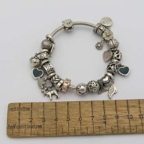 Annabelle sterling silver charm bangle/bracelet with charms - Weighs 61,1 grams - 18 cm