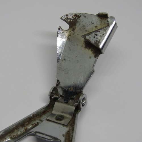 Vintage keychain bottle opener and can opener