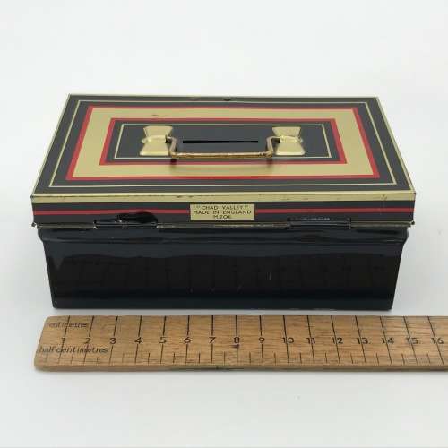 Vintage savings money box with key