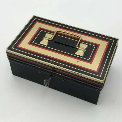 Vintage savings money box with key