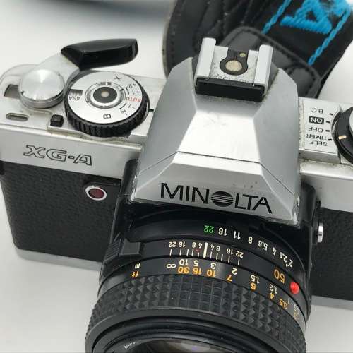 Vintage Minolta XG-A 35mm camera with 50mm 1:2 lens plus flash and Minolta 200mm 1:3,5 lens in bag