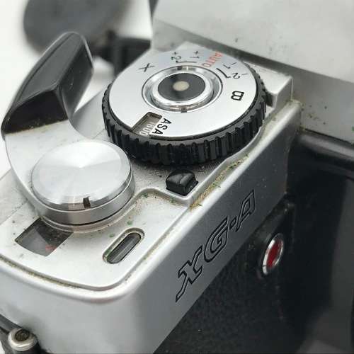 Vintage Minolta XG-A 35mm camera with 50mm 1:2 lens plus flash and Minolta 200mm 1:3,5 lens in bag