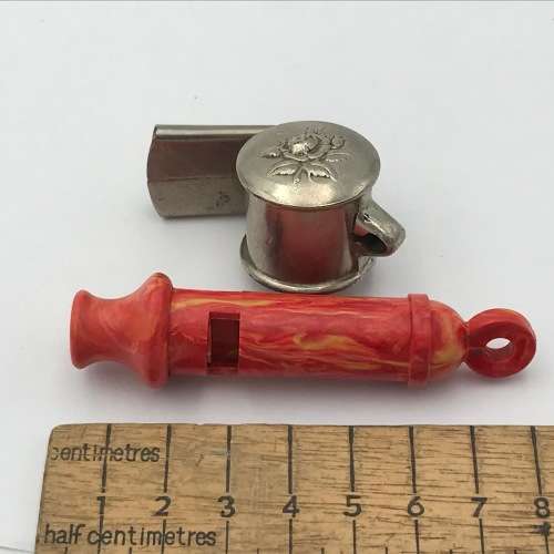 Pair of vintage whistles