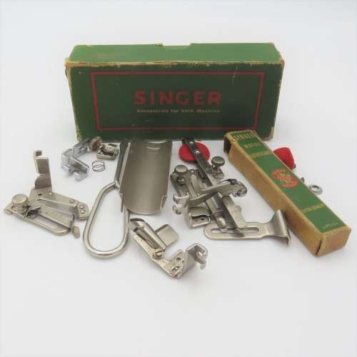 Singer box with various items inside