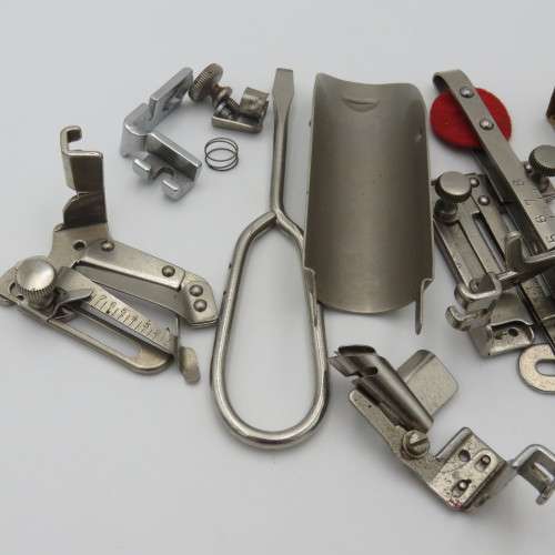 Singer box with various items inside