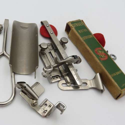 Singer box with various items inside