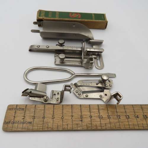 Singer box with various items inside