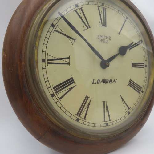 Antique Smiths Enfield London wall clock - Runs and stops